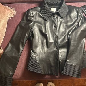 Armani collezioni black leather jacket. With fabric detailed collar, and cuffs.